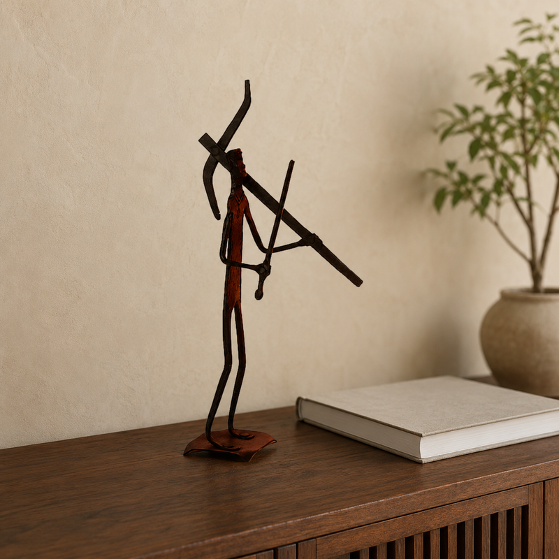 Bastar wrought iron tribal hunter-warrior sculpture styled on a teak console