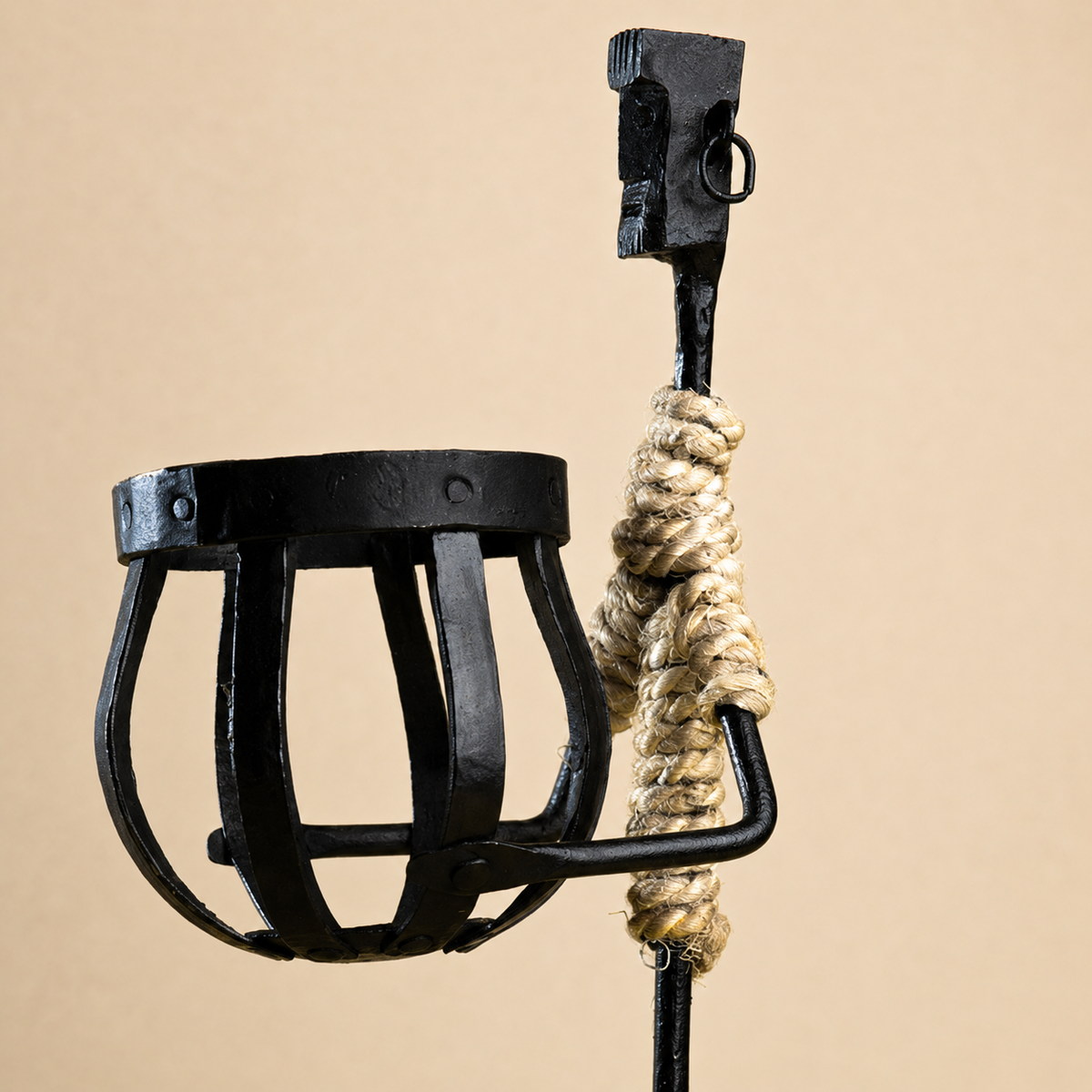 Close view of the forged iron basket, ring earring, and natural jute wrapping