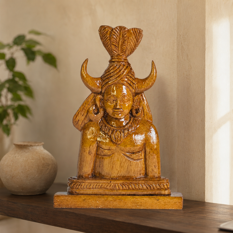 Bastar Madia wooden sculpture displayed on a shelf in a warm contemporary interior