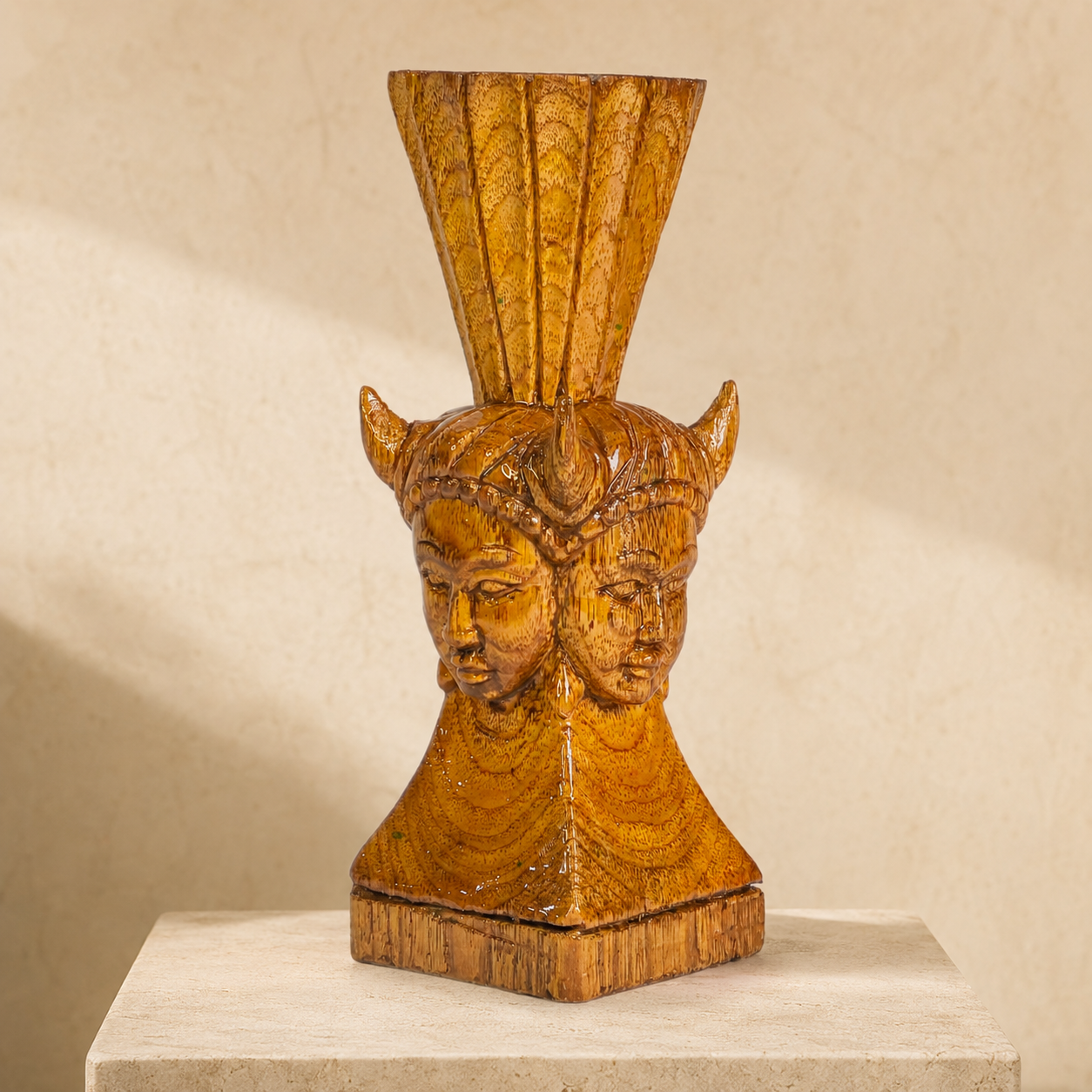 Bastar Wood Carving Madia-Madin paperweight on a warm ivory studio pedestal