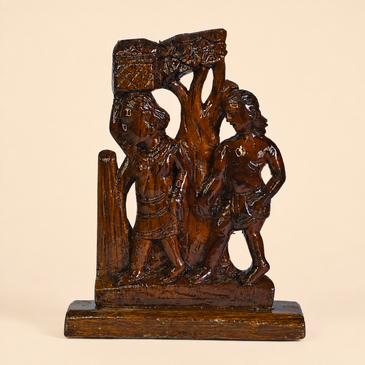 Hand-carved Bastar Madia-Madin tribal couple sculpture on a clean ivory studio background