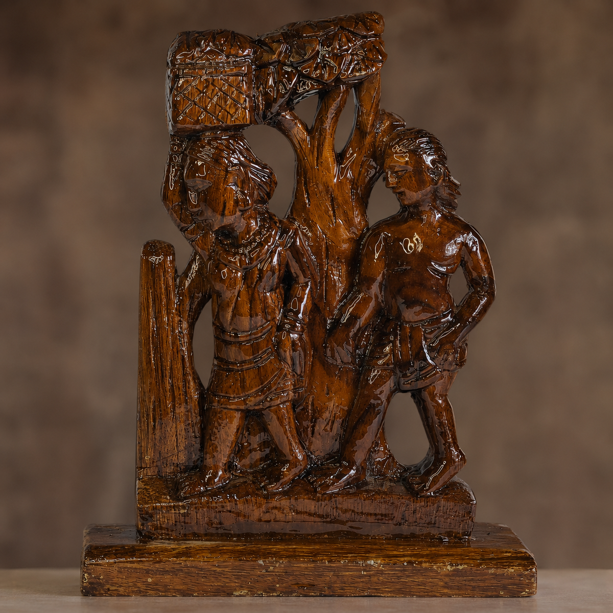 Close craftsmanship view of the carved figures, tree canopy and honey-brown wood grain