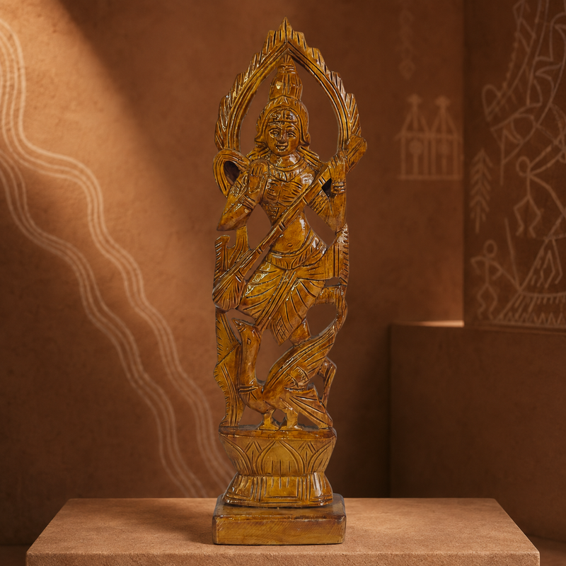 Bastar wood-carved Saraswati statue in an earthy cultural gallery setting