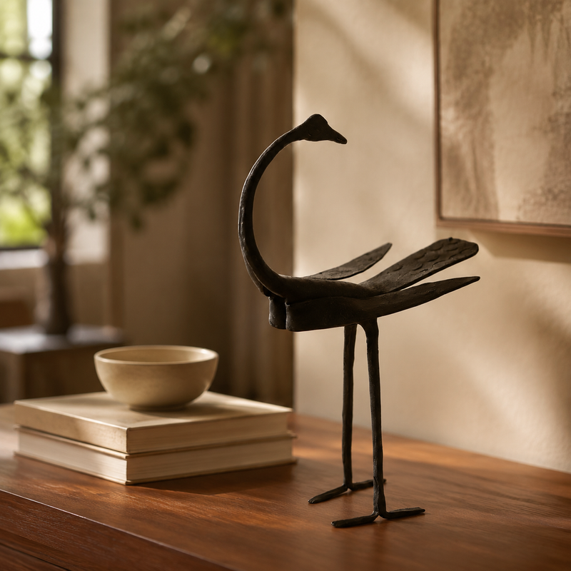 Bastar Wrought Iron Crane Statue styled on a contemporary teak console