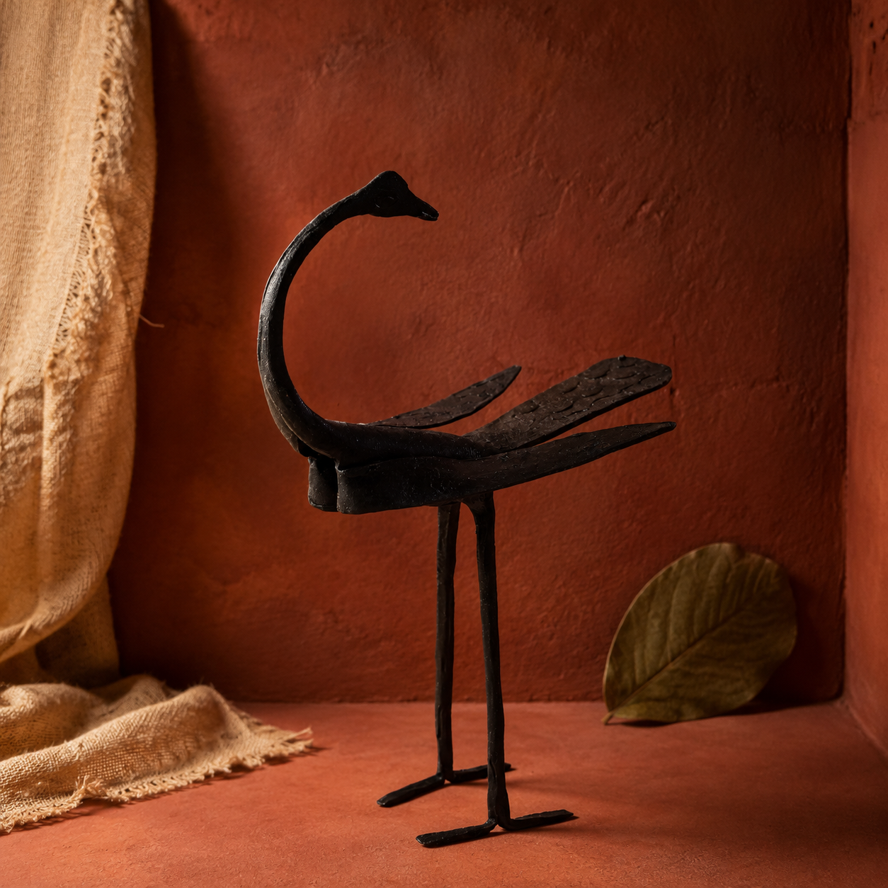 Bastar Wrought Iron Crane Statue in an earthy craft-inspired setting