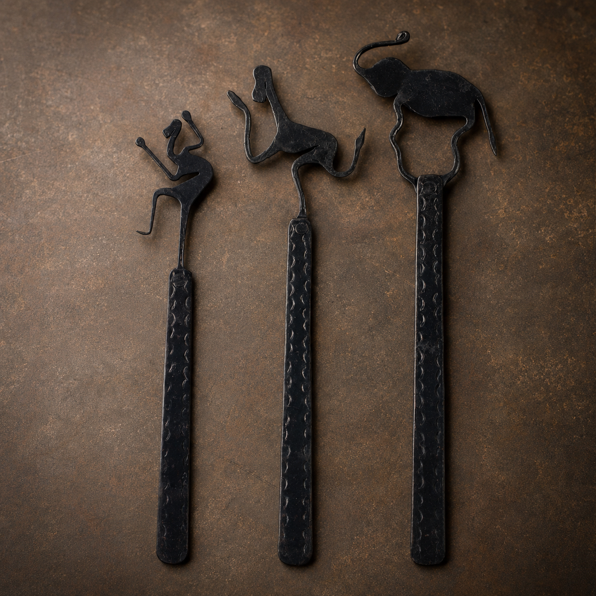 Close view of the forged motifs, circular joints, and stamped bookmark shafts