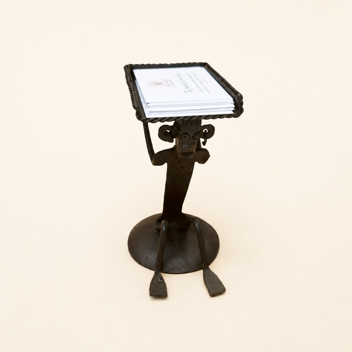 Bastar wrought iron tribal card holder with business cards on a clean ivory studio background