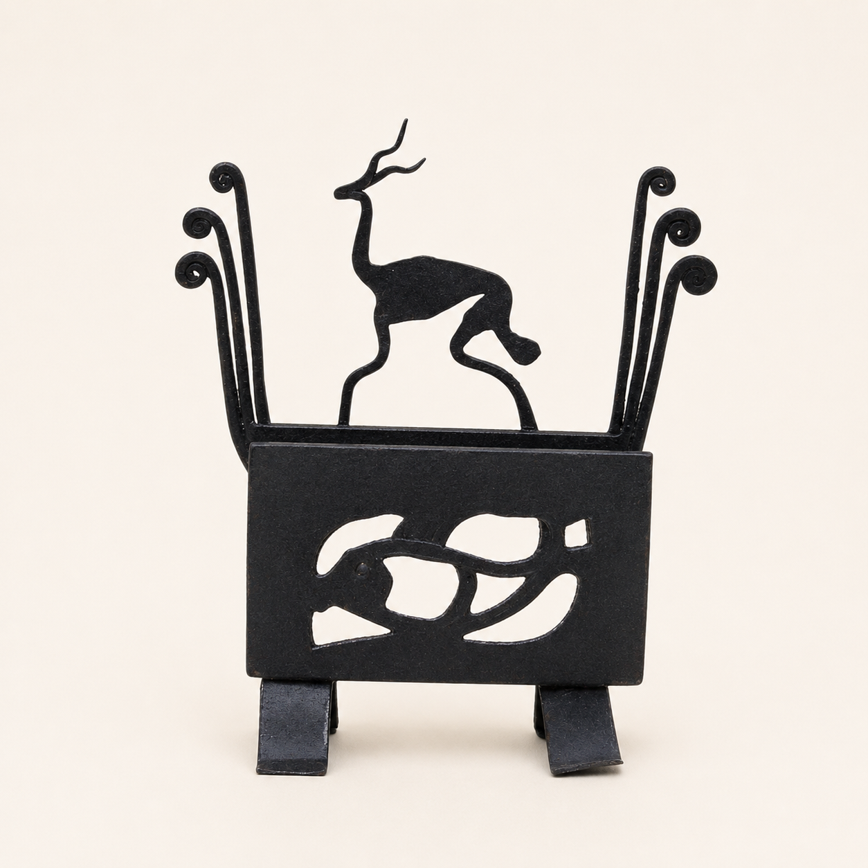 Bastar wrought iron deer card holder on a clean warm studio backdrop
