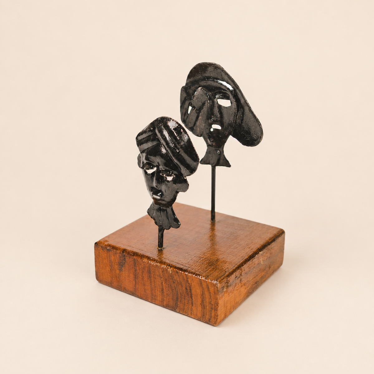 Bastar wrought iron two-mask card holder on a clean ivory background