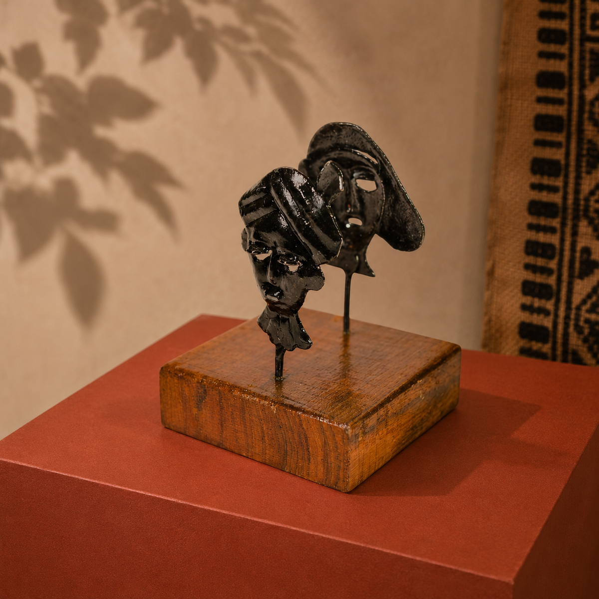 Bastar wrought iron two-mask card holder in a warm Indian craft editorial setting
