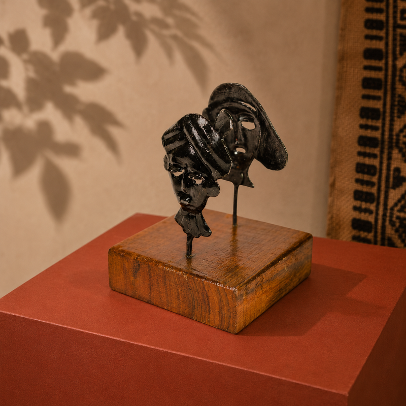 Bastar wrought iron two-mask card holder in a warm Indian craft editorial setting