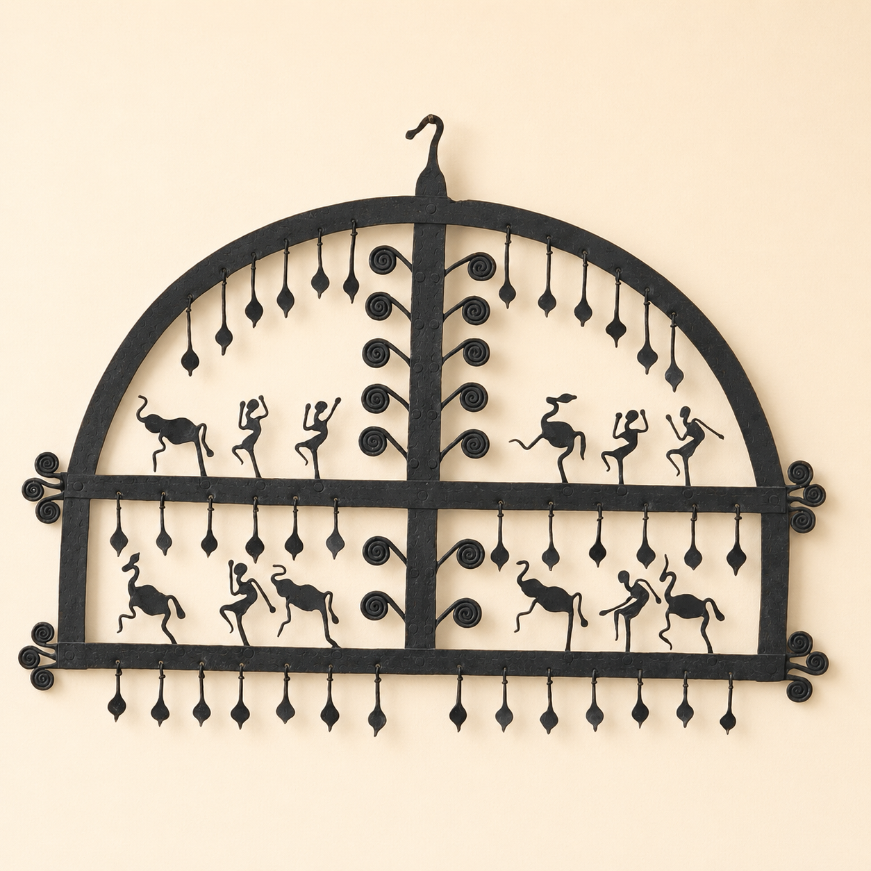 Bastar wrought iron decorative frame with animal and dancer motifs on an ivory wall