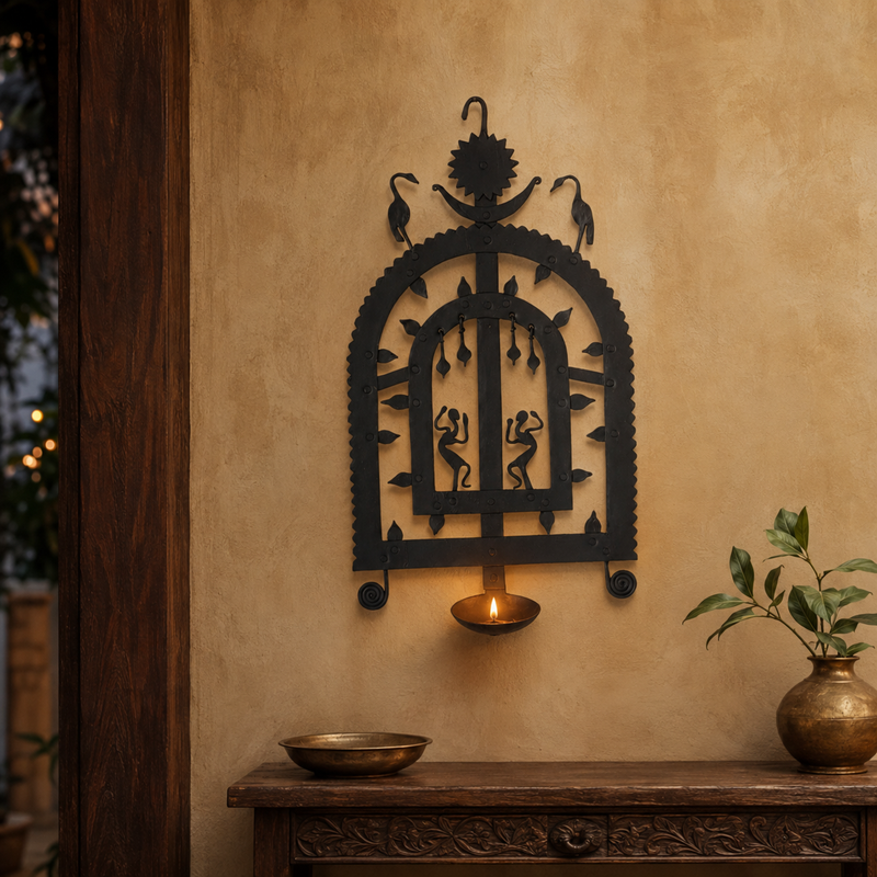 Bastar wrought iron diya wall frame Design 2 displayed in a warm entryway