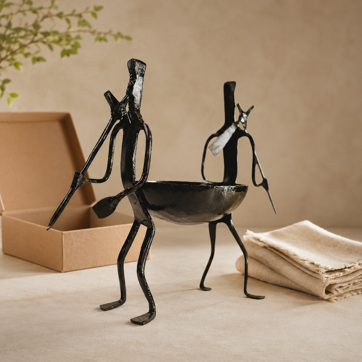 Bastar wrought iron dry fruit holder presented beside a kraft gift box and cotton wrap