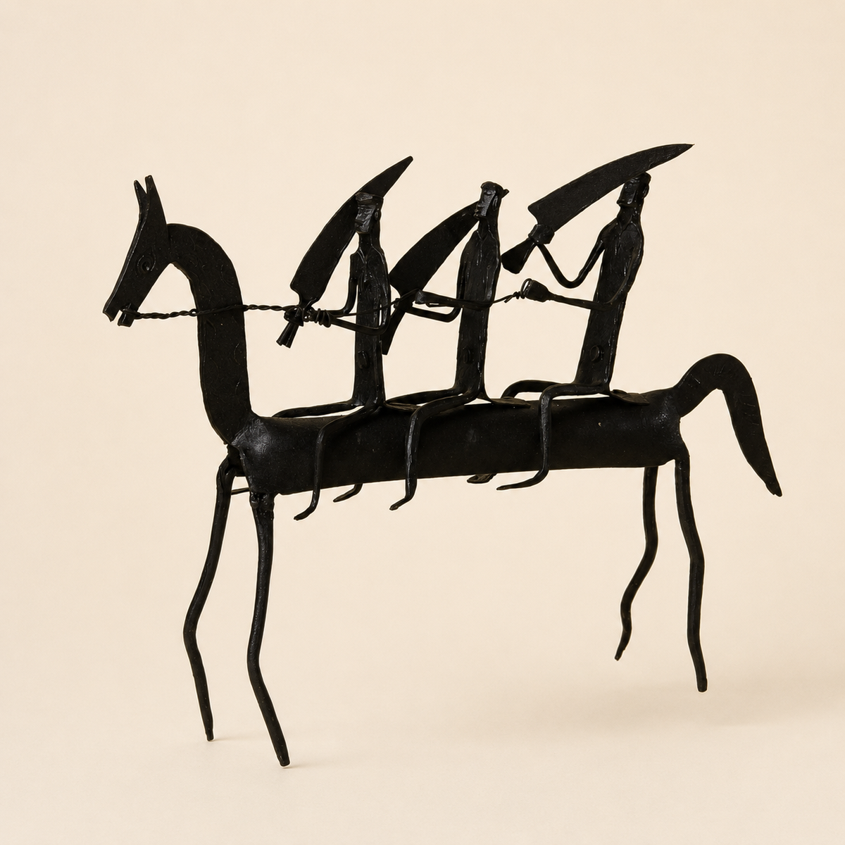 Bastar wrought iron horse-and-riders figurine on a warm ivory catalogue background