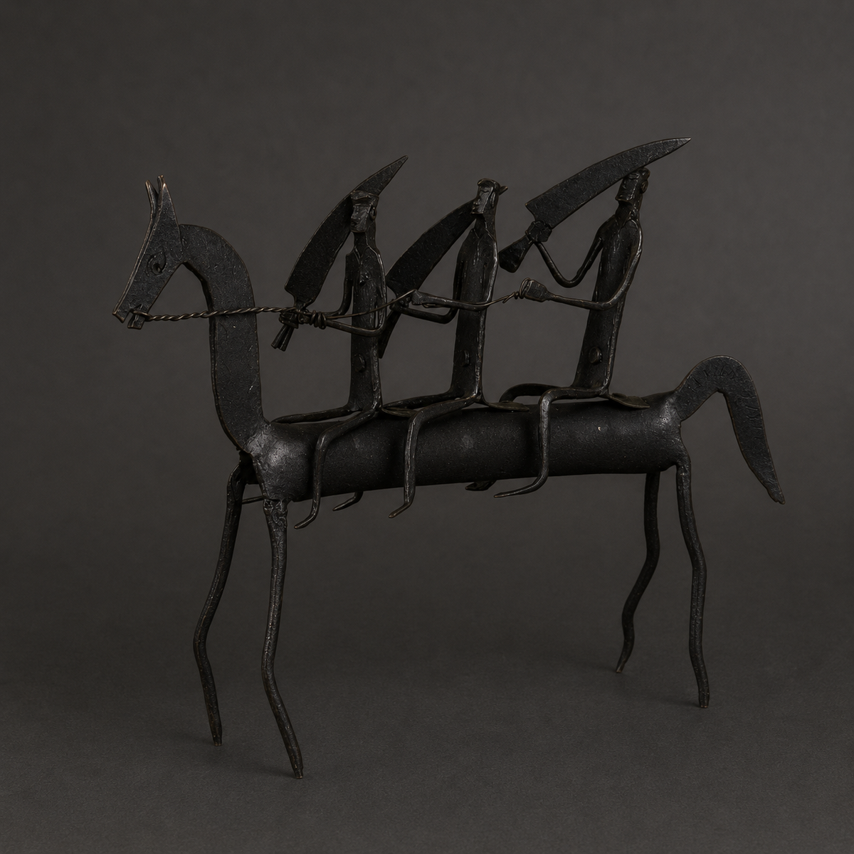Craft detail of a Bastar iron horse with three riders, reins and raised implements