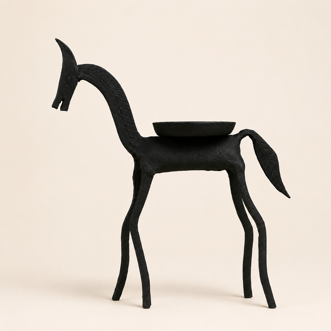 Black Bastar wrought iron horse figurine with back dish on a warm ivory catalogue background