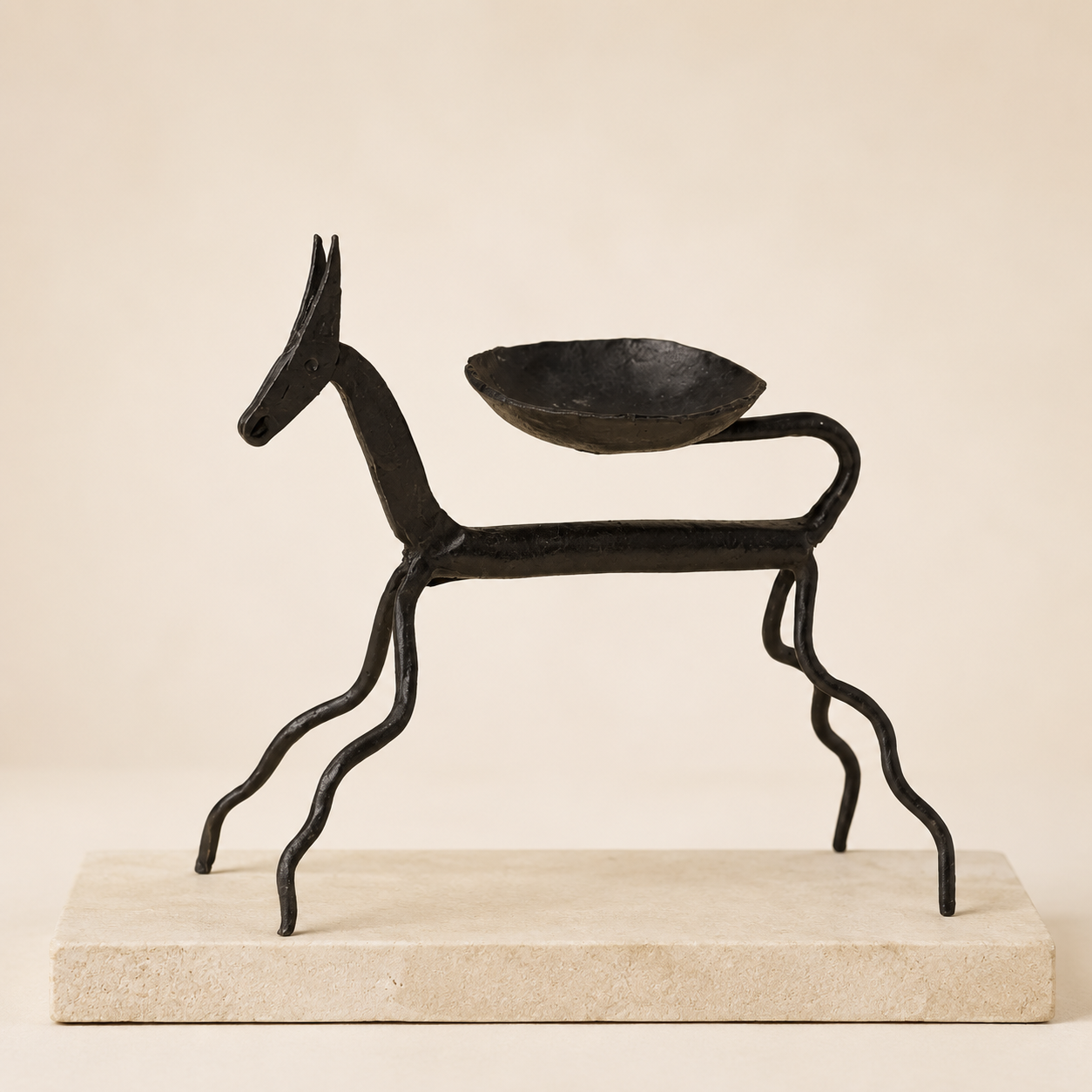 Bastar Wrought Iron Horse Oil Lamp on a warm sandstone plinth