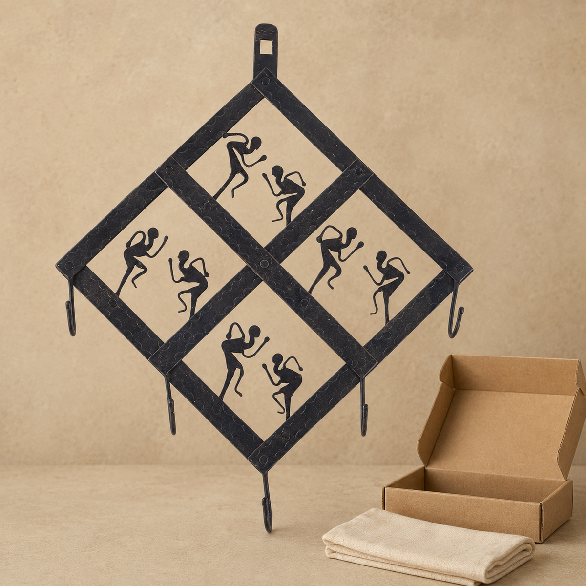 Bastar wrought iron dancer key hanger displayed beside an open gift box