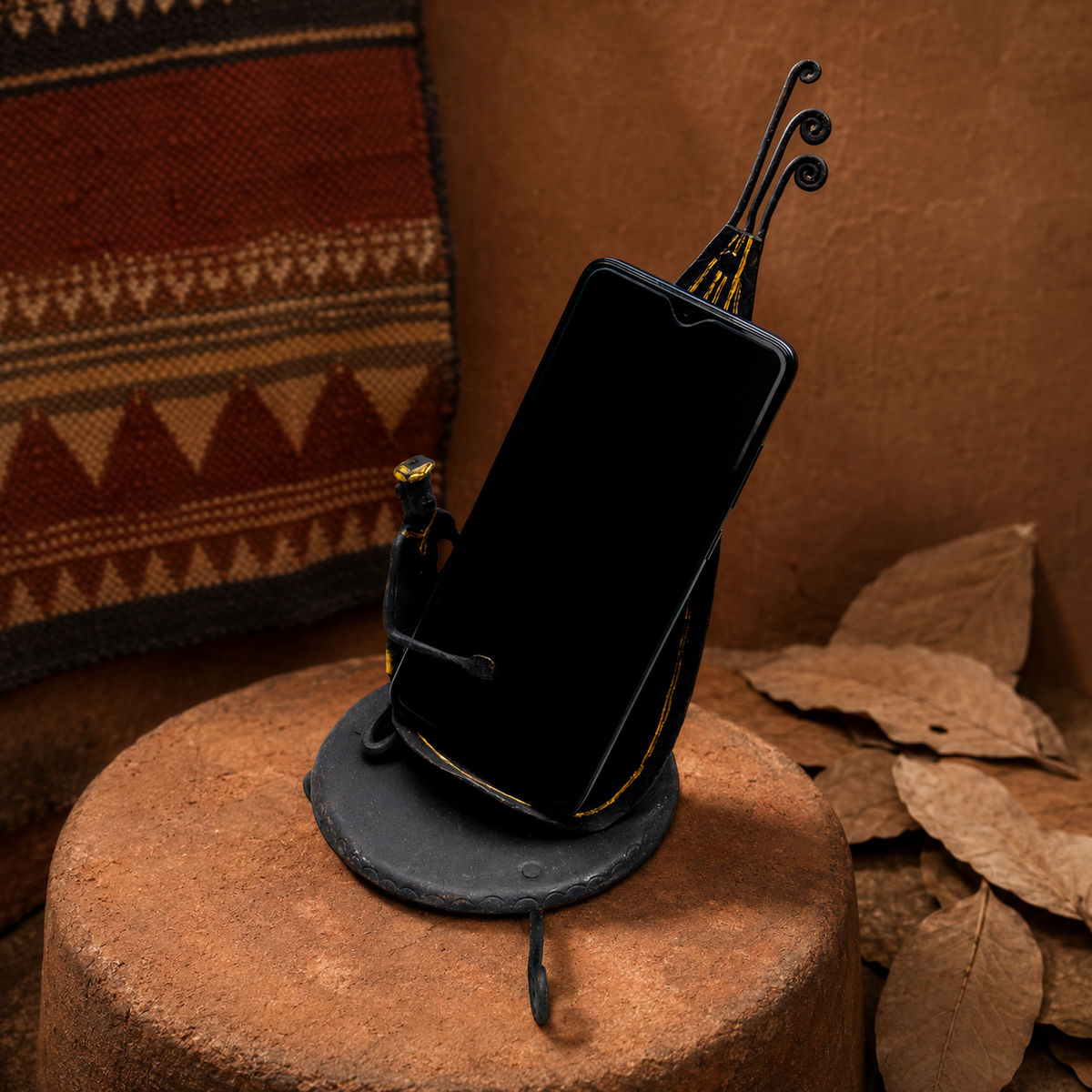 Bastar wrought iron mobile holder in an earthy craft-inspired setting