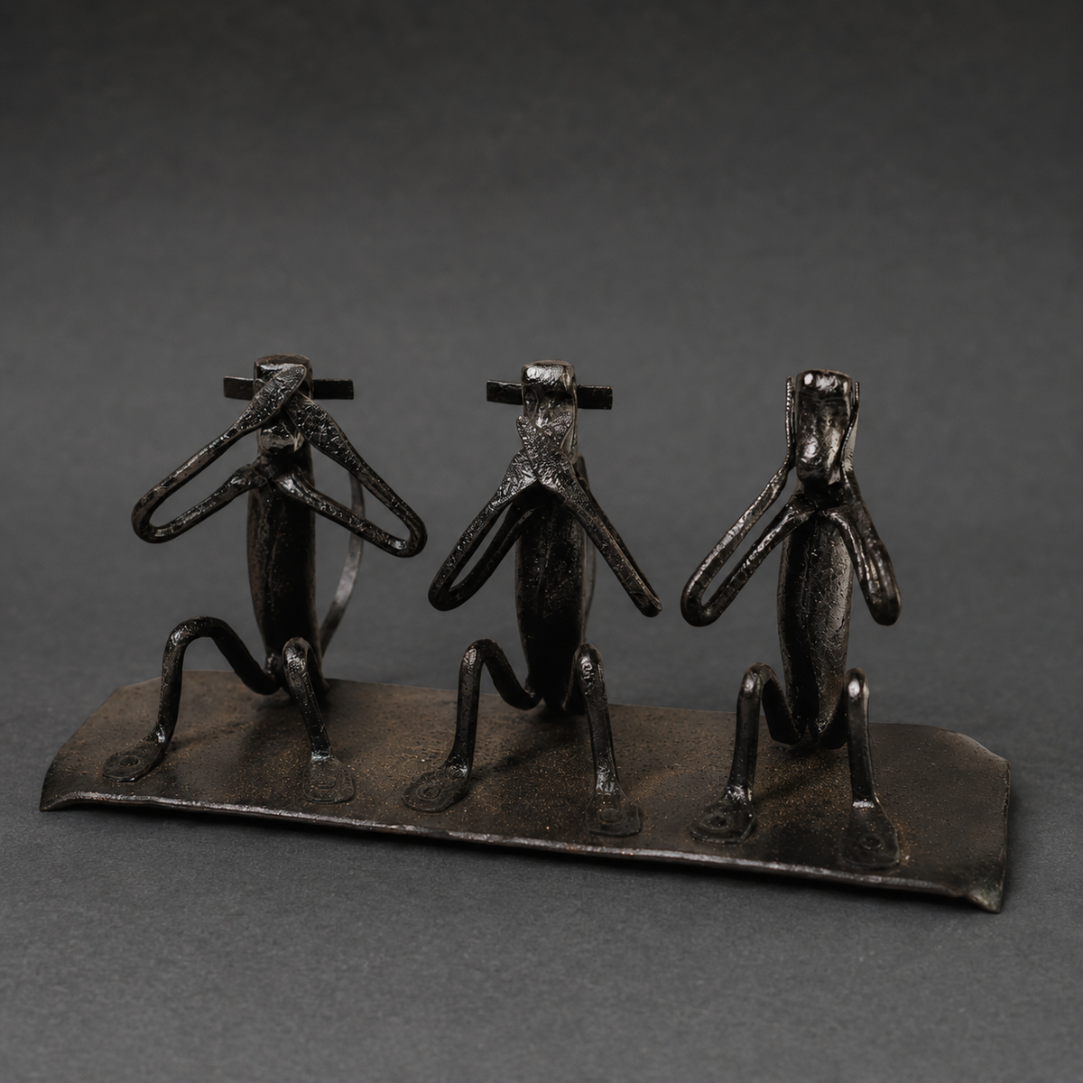 Detailed view of the gestures, welds and patina of a Bastar iron monkey sculpture
