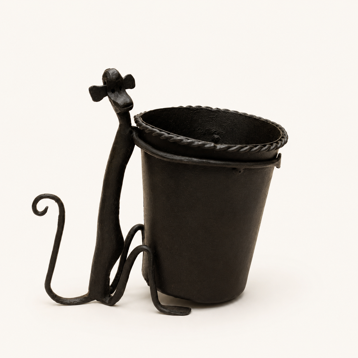 Bastar wrought iron pen stand on a clean warm studio backdrop