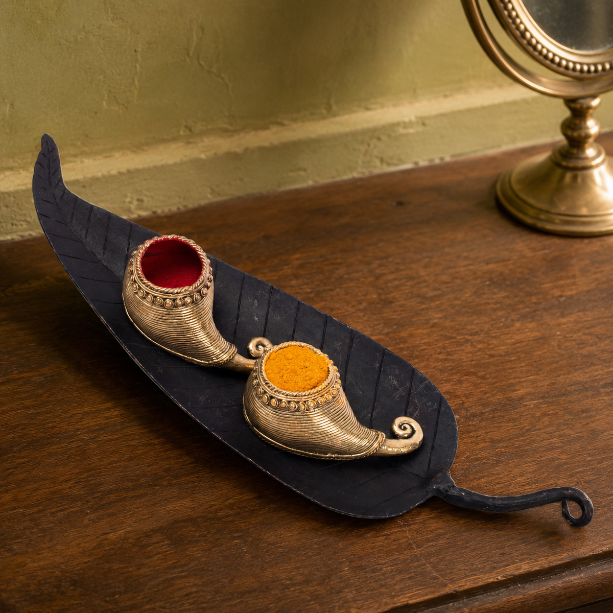 Bastar wrought iron sindoor holder displayed on a wooden dressing shelf