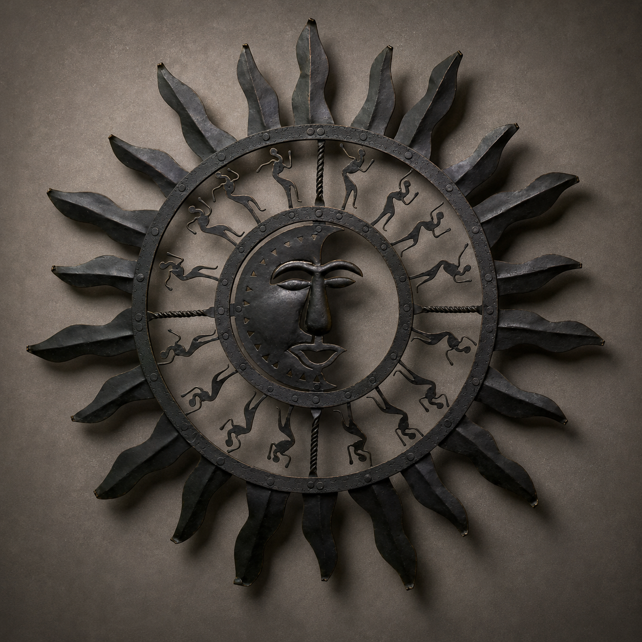 Craft detail of the forged rays, riveted rings and tribal figures on a Bastar iron sun wall decor