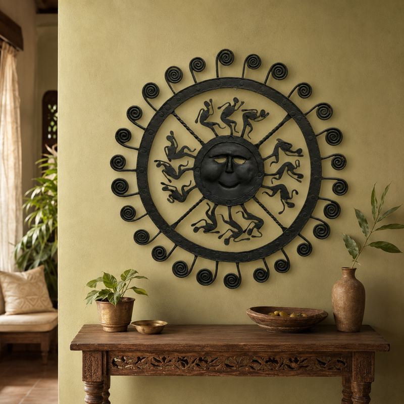 Bastar wrought iron sun wall decor displayed above a carved wooden console in a warm interior