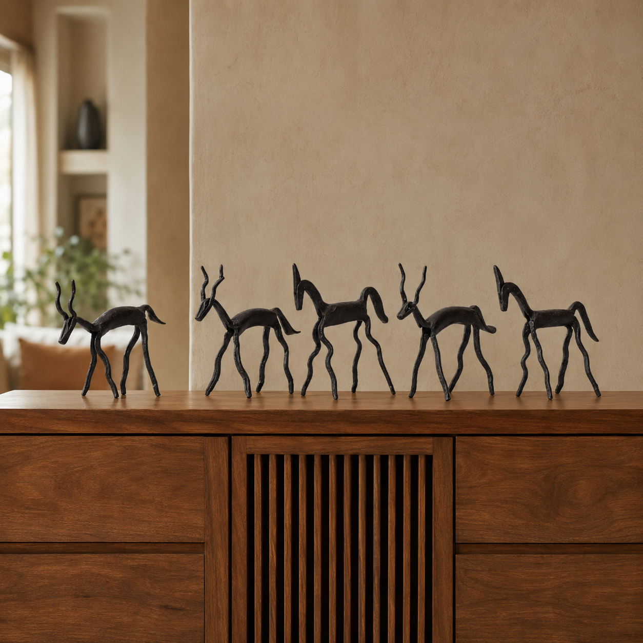 Five-piece Bastar Wrought Iron Tribal Animal Set styled on a teak console