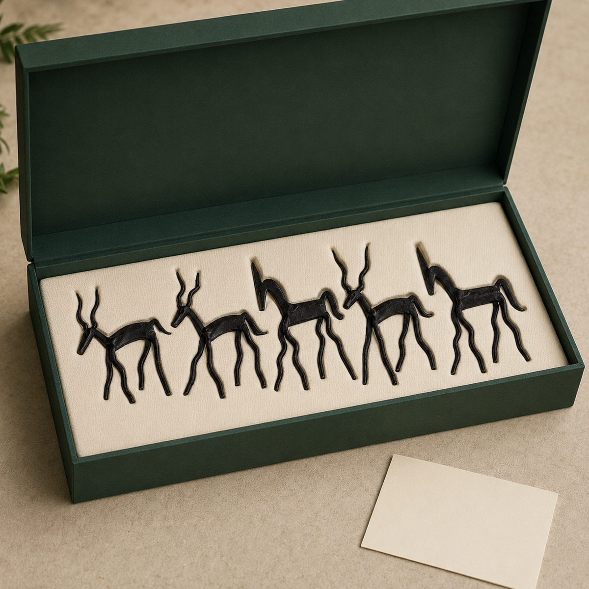 Five-piece Bastar hand-forged wrought iron tribal animal set arranged in a fitted gift box