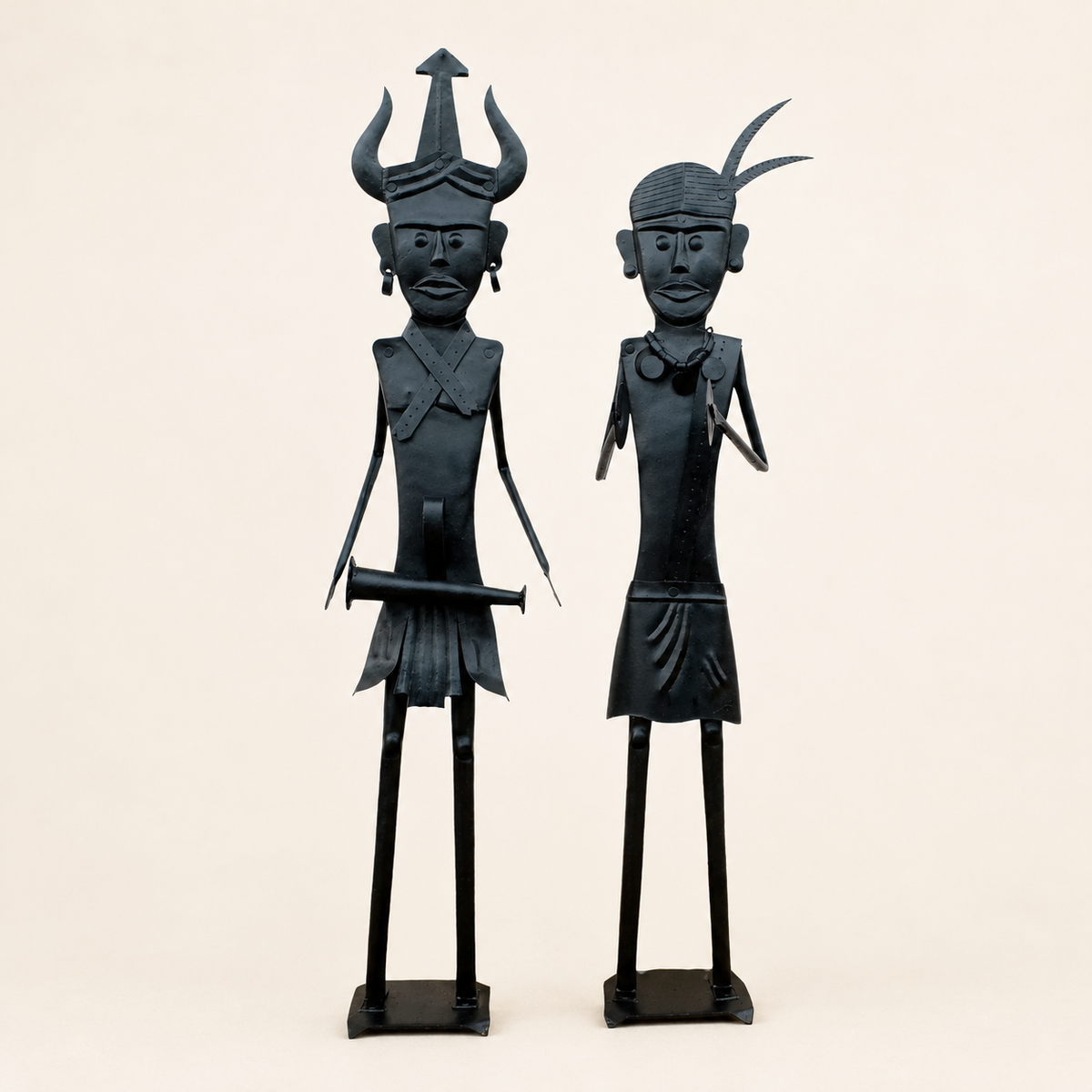 Two-piece Bastar wrought iron tribal figurine set on a warm ivory catalogue background