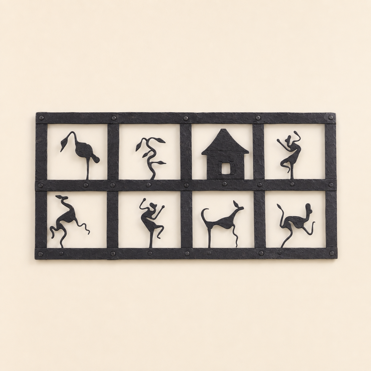 Bastar wrought iron wall decor with eight tribal motif panels on a clean ivory wall