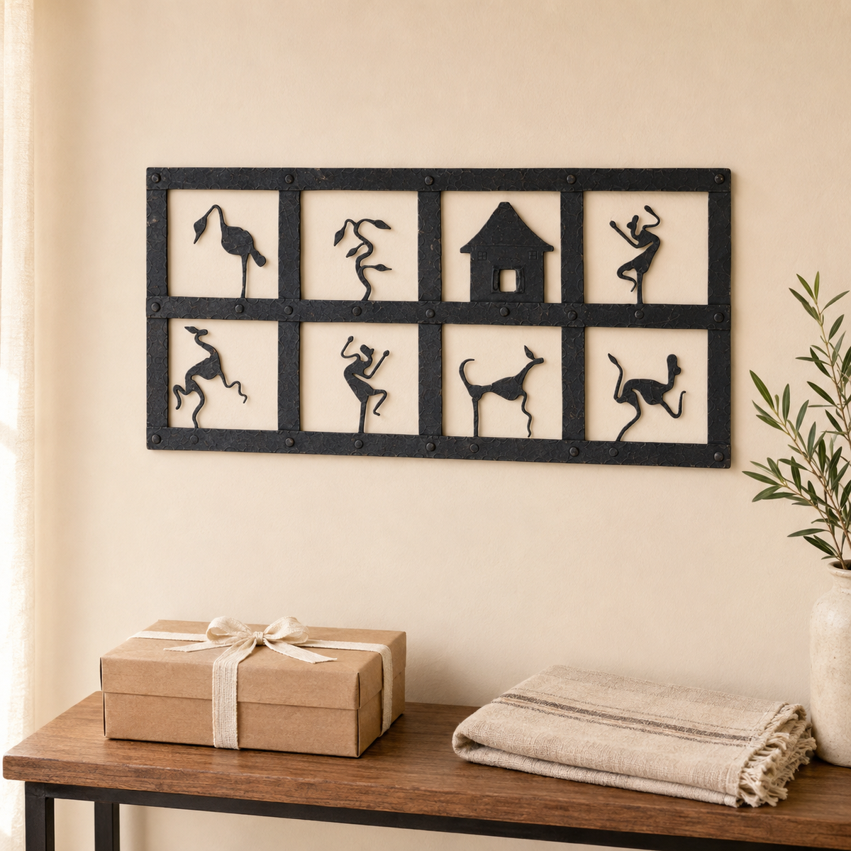 Bastar wrought iron wall decor styled above a wrapped housewarming gift
